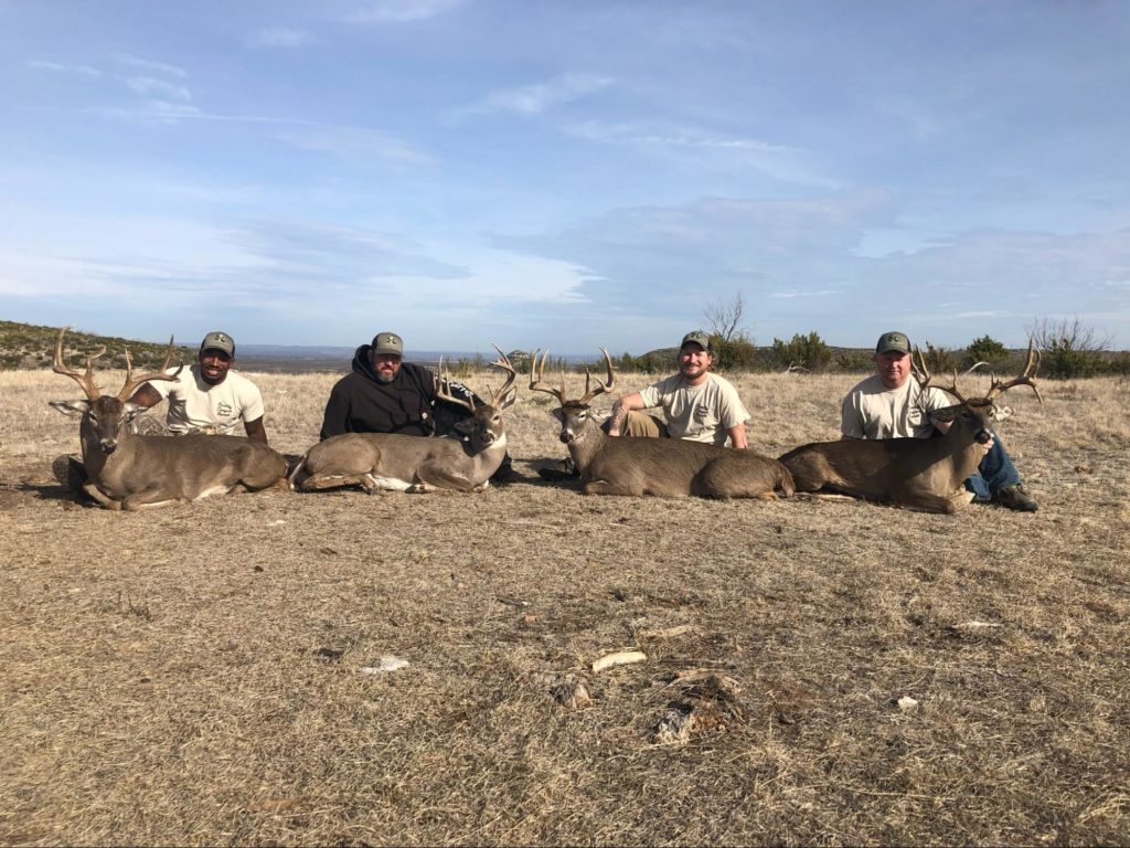 Four warriors with their deer at Poverty Canyon Ranch. Photo courtesy of Poverty Canyon Ranch.