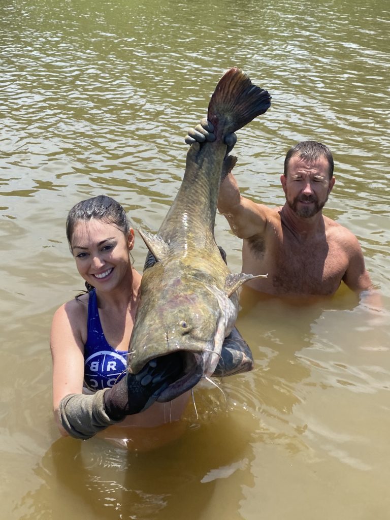 Teen uses noodling style to catch huge flathead catfish at Clarks