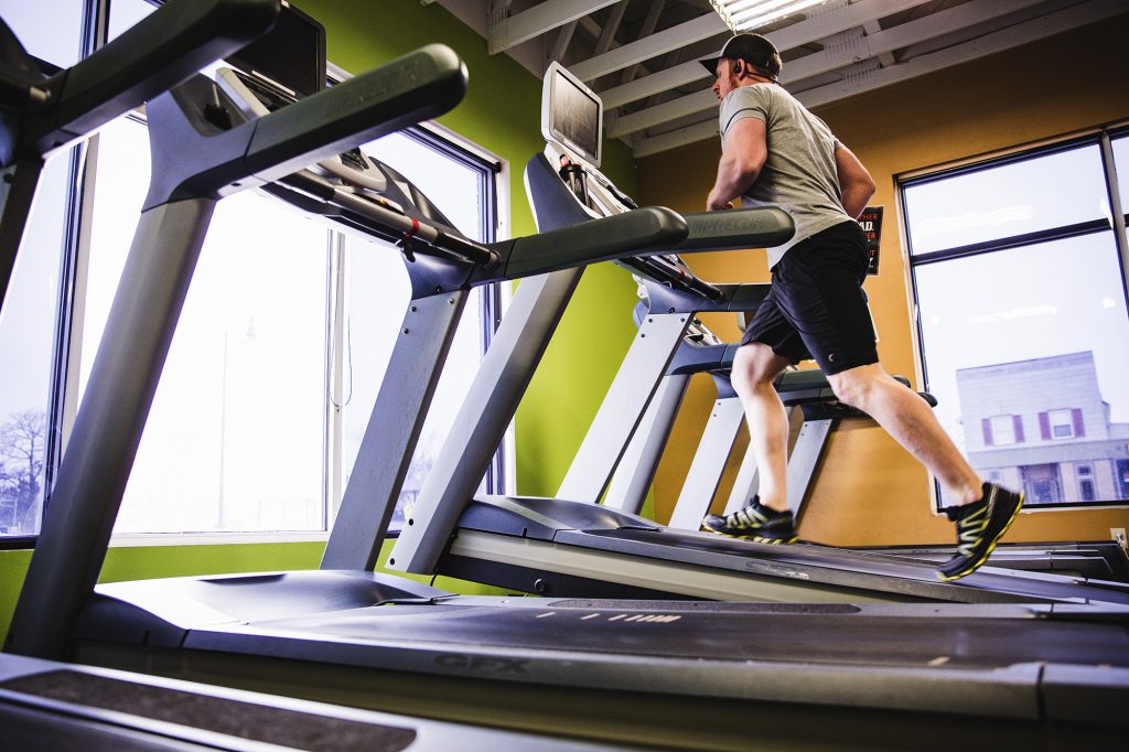 man running on treadmill