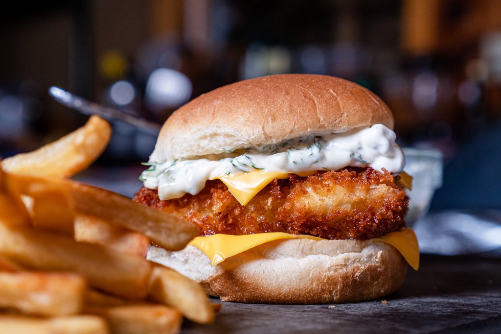 sandwich with tartar sauce and french fries