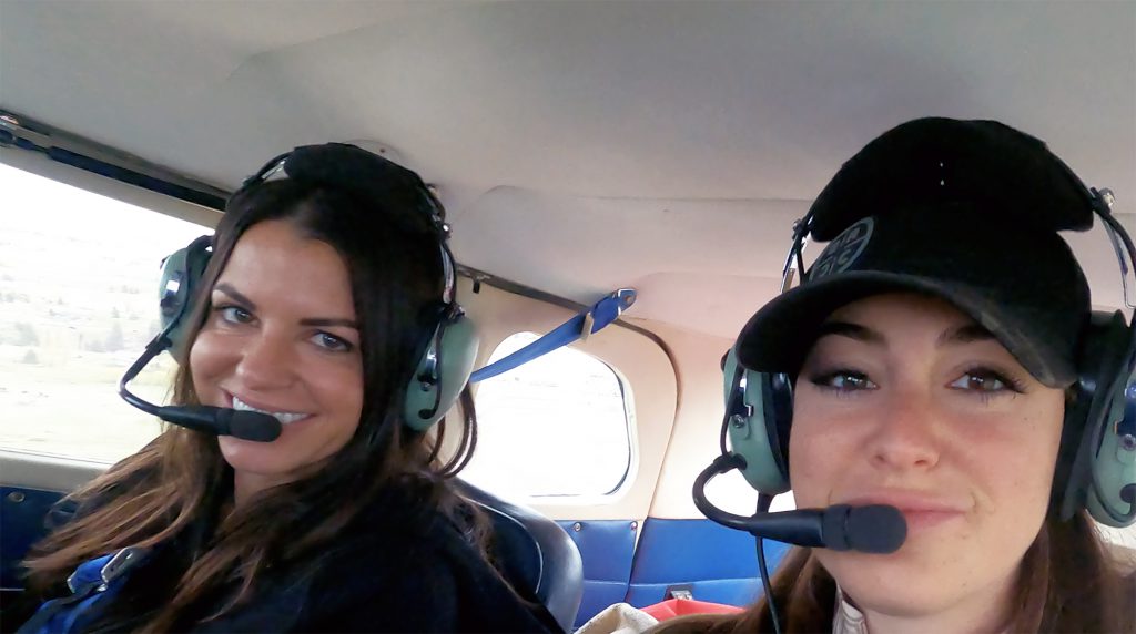 laura zerra and heather lynn in a bush plane