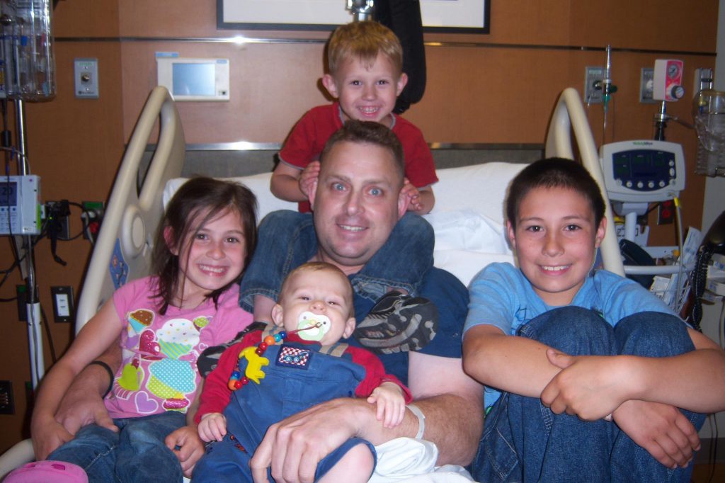 eric burkett and children in hospital