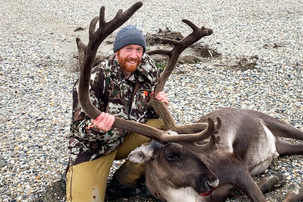 hunter with caribou