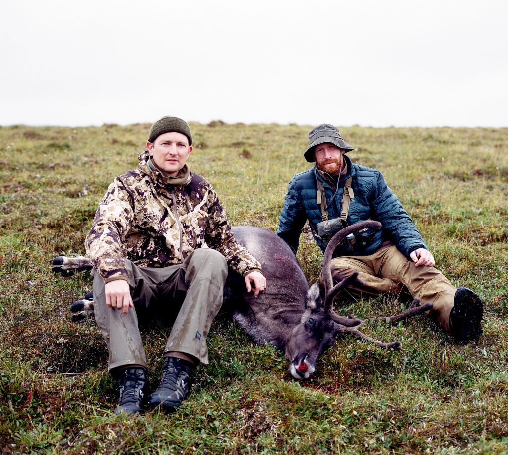 two men caribou bull alaska caribou hunt