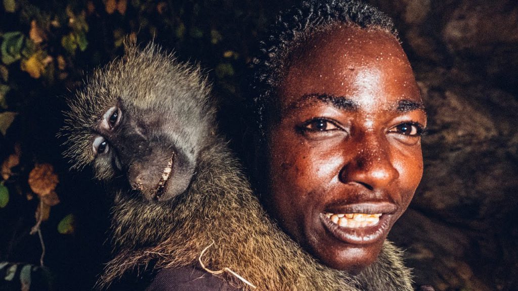 hadza with dead baboon hunter-gatherers