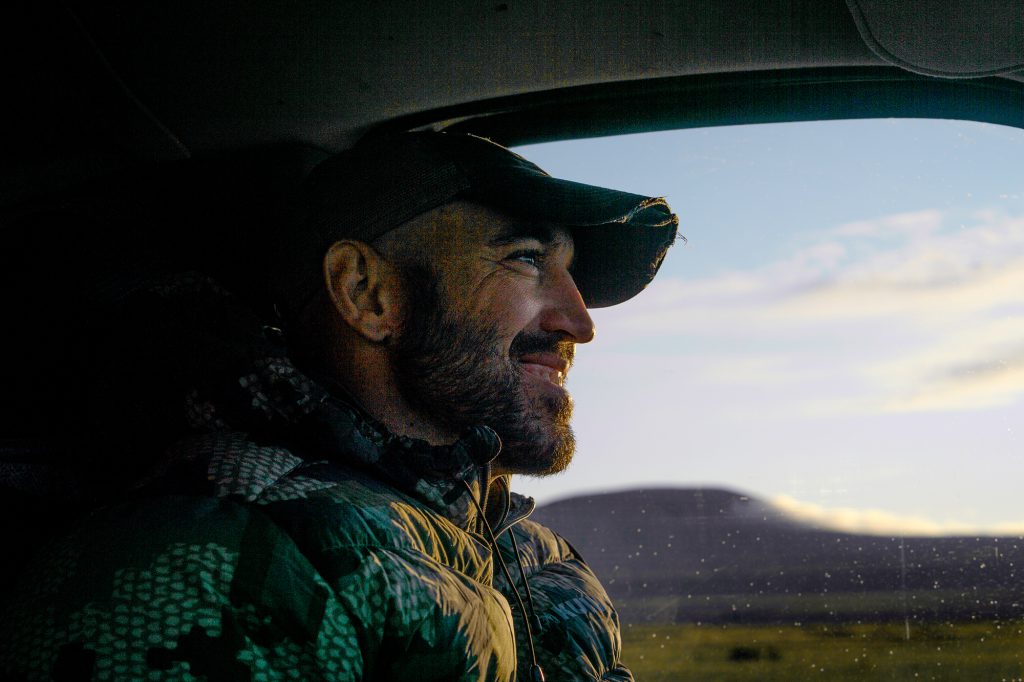 man driving wilderness