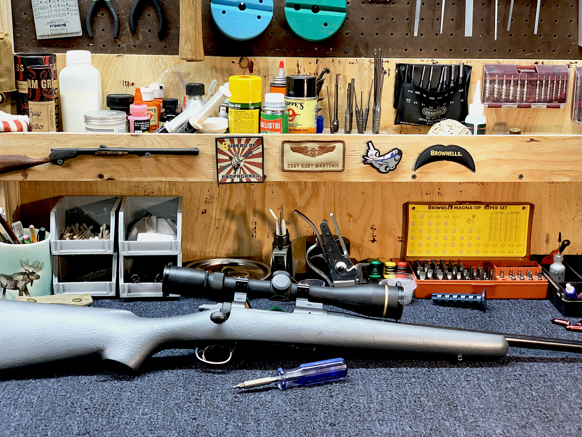 rifle on gunsmith bench