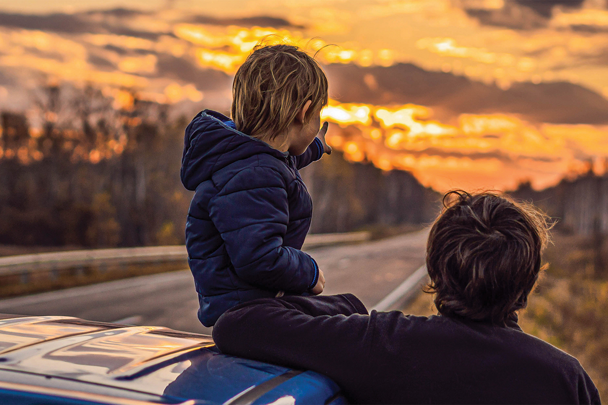 kid on car roof