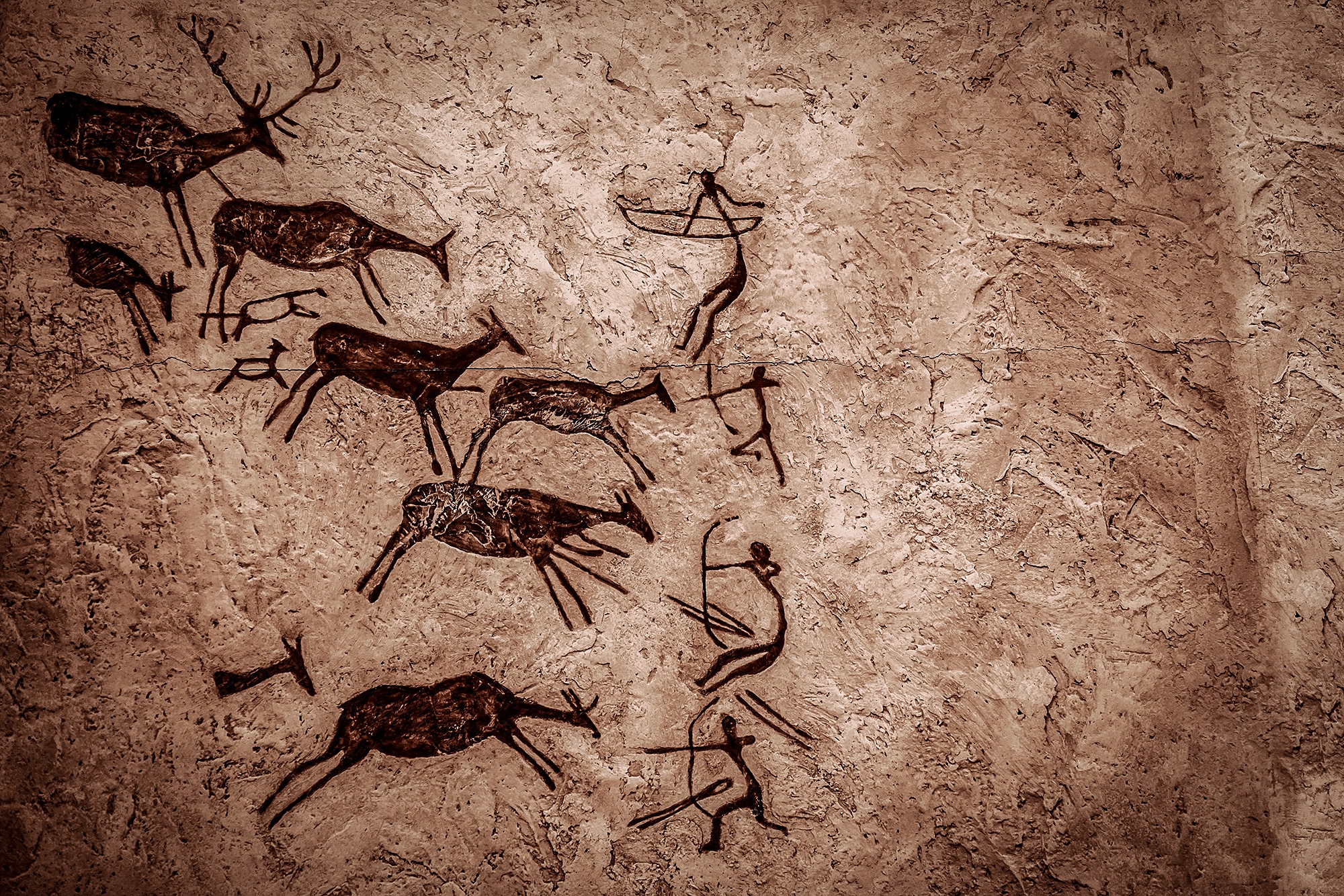 Ancient rock painting of a hunting scene.
