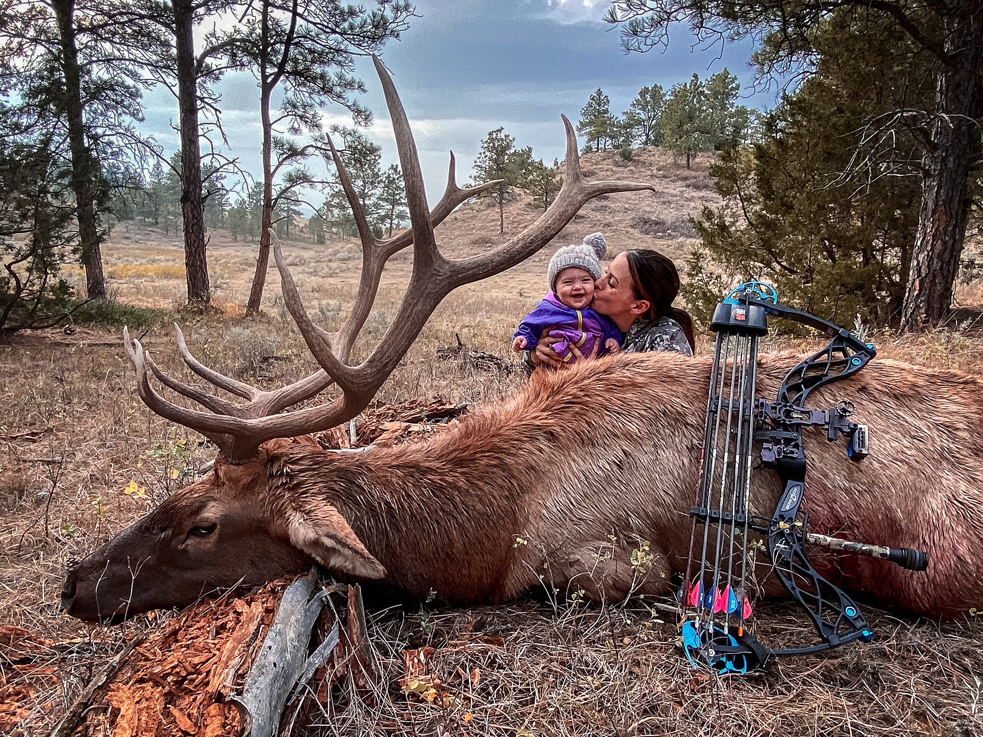 Alishia Zemlicka with her infant daughter and a nice bull elk