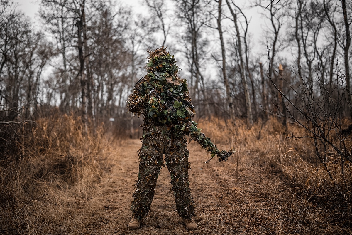 hunting ghillie suit in the woods