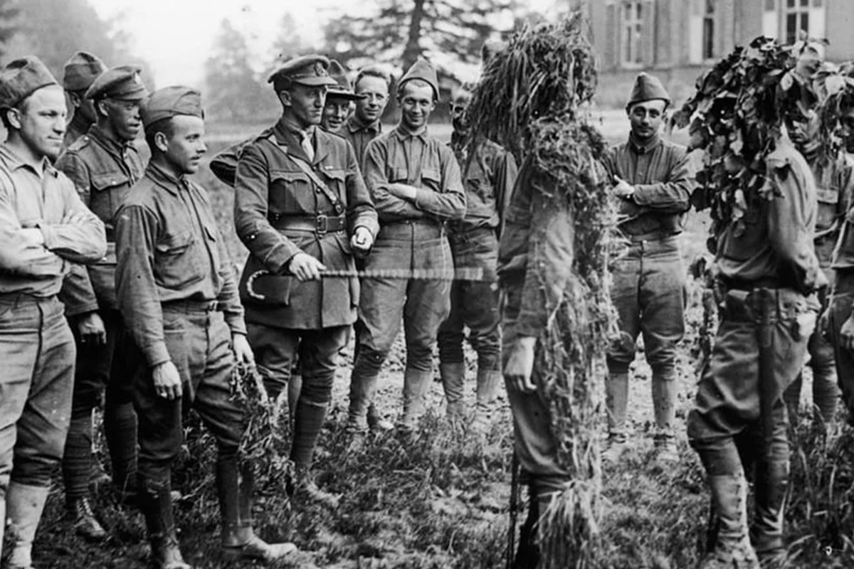 World War 1 American soldiers testing out self-made ghillie suits with the British
