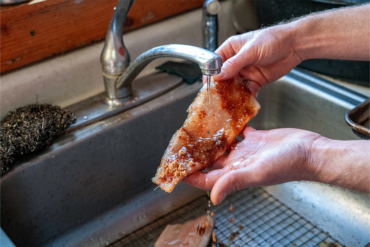 Rinsing off the fillet for the smoked trout dip