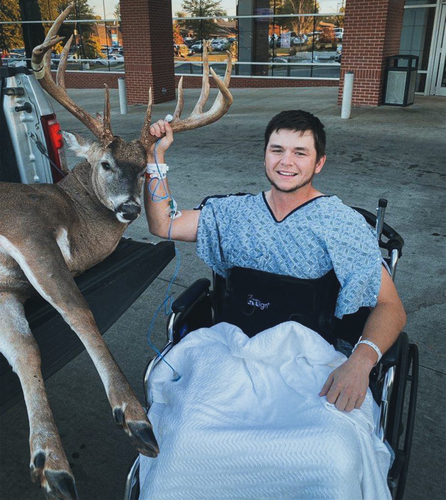 Chase Watson posing with the buck he shot before falling from his treestand resulting in a fractured leg and broken back.