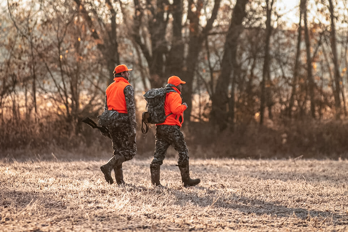 Sitka hunting vests in a field