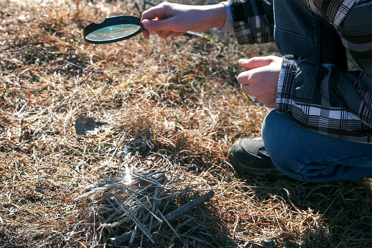 Focusing sunlight on tinder through a magnifying glass is an easy way to start a fire.