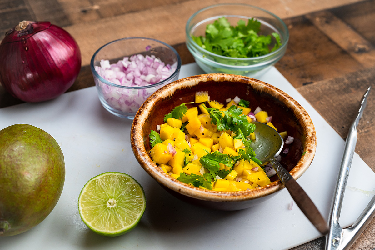 A simple mango salsa adds a little sweetness, tartness, and texture to this burger recipe.