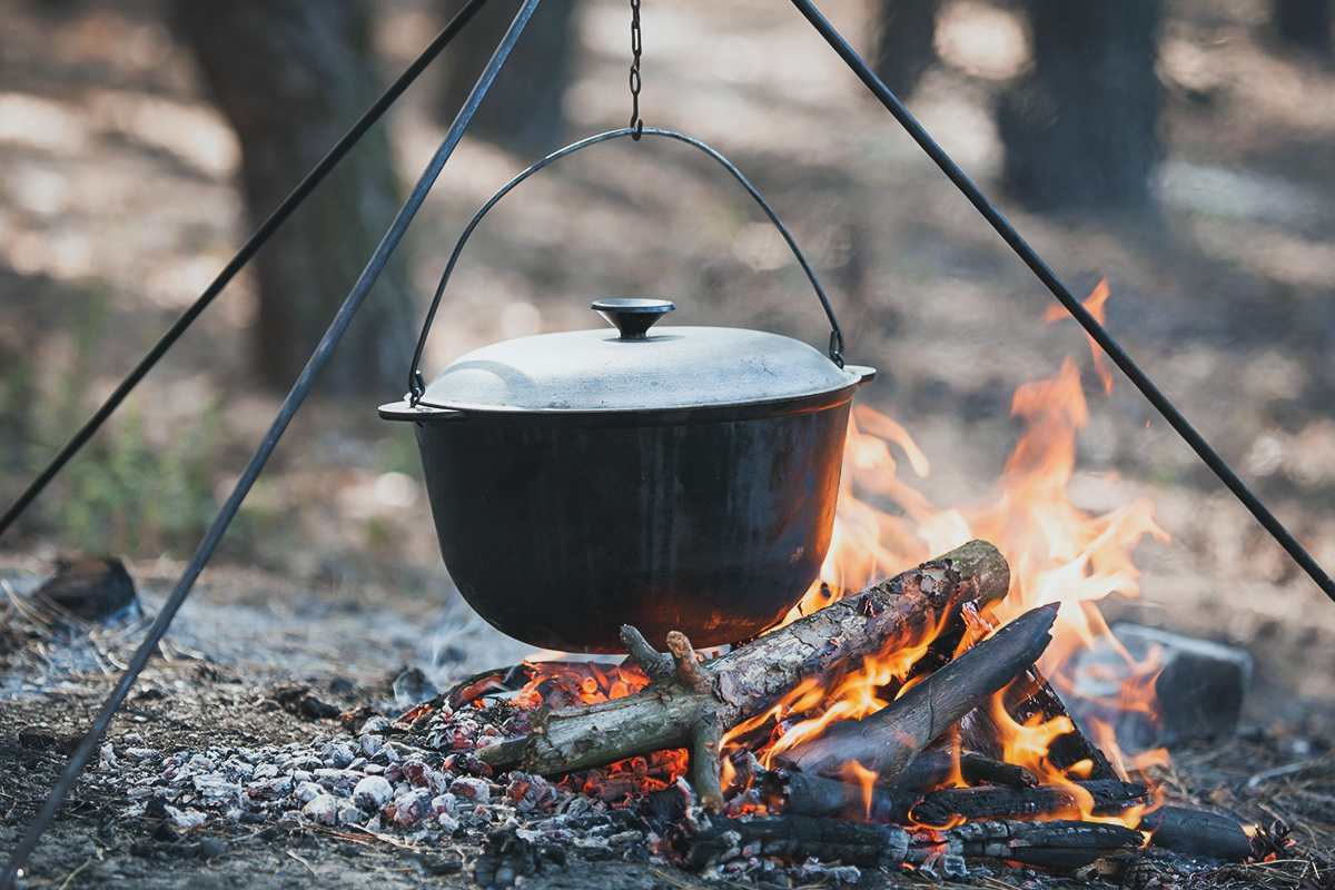 A campfire tripod keeps your pots out of the ashes and over the campfire flames.