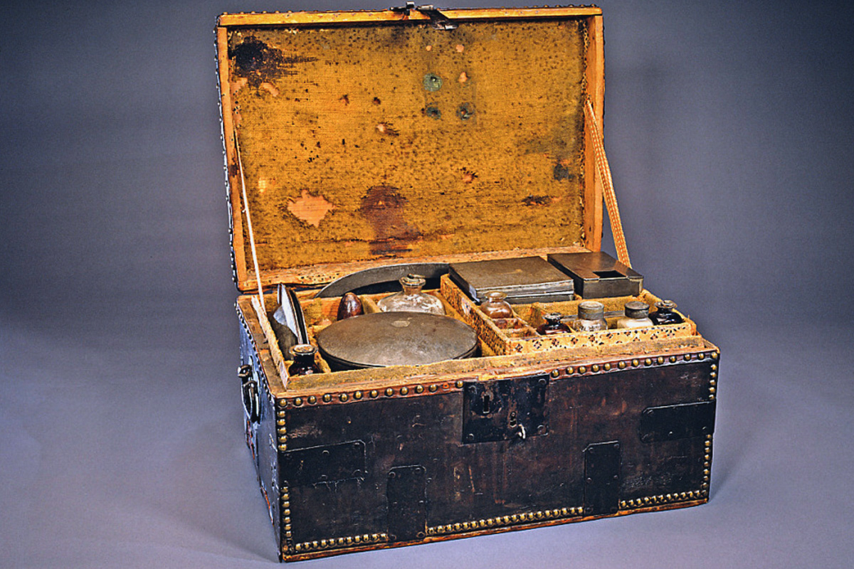 George Washington's Revolutionary War camp chest which included tin plates and platters, tin pots with detachable wooden handles, glass containers for condiments such as salt, pepper, and sugar, as well as knives and forks with dyed black ivory handles.