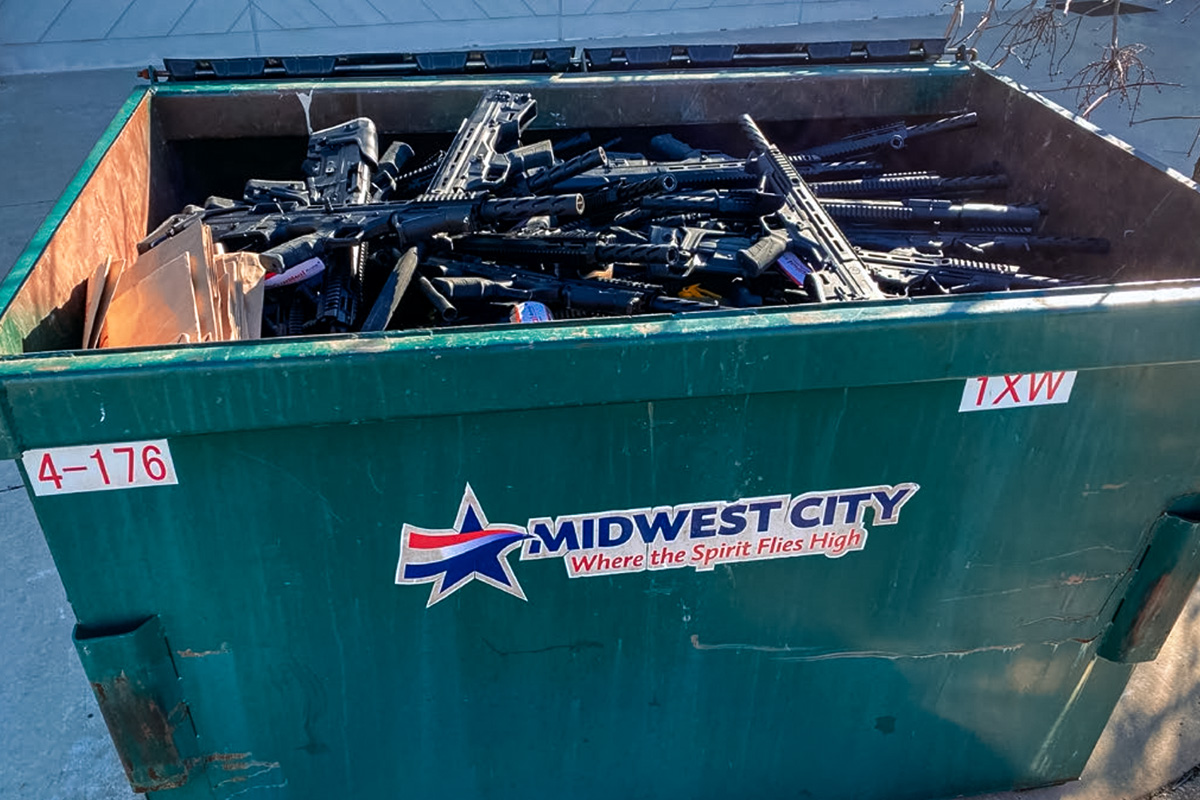 dumpster filled with guns